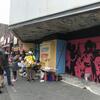 community members painting a mural at the Uptown Theater
