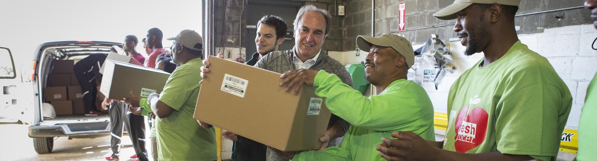 Volunteers unload donations.