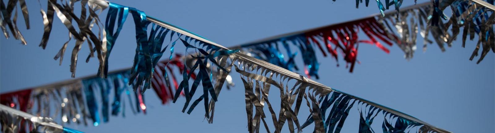 red, blue and silver banners hang